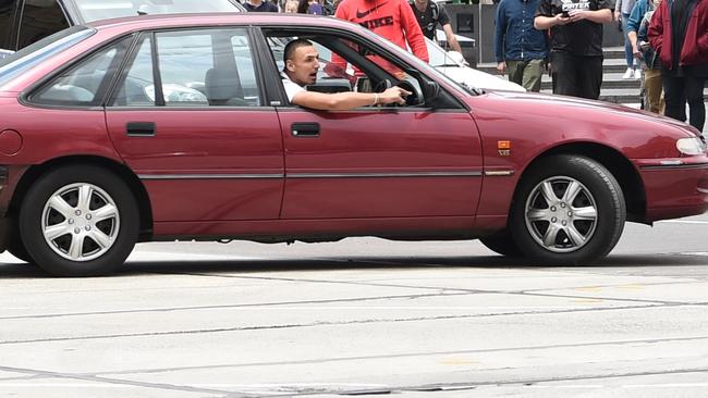 The car pictured outside Flinders St railway station before the deaths. Picture: Tony Gough