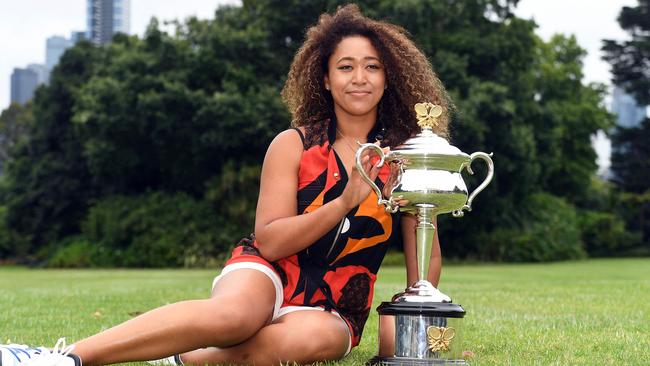 Naomi Osaka poses with the 2021 Australian Open winner's trophy at the Government House on Sunday. Picture: William West/AFP