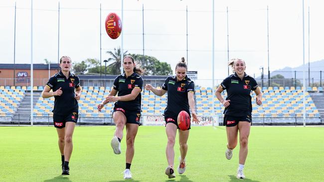 The Hawthorn Hawks AFL Women's team will play a game in Cairns for a second season, when they take on the Melbourne Demons at Cazalys Stadium on October 24. Hawks players Greta Bodey, Mattea Breed, Emily Bates and Casey Sherriff are looking forward to playing in front of a large and enthusiastic Far North Queensland crowd. Picture: Brendan Radke