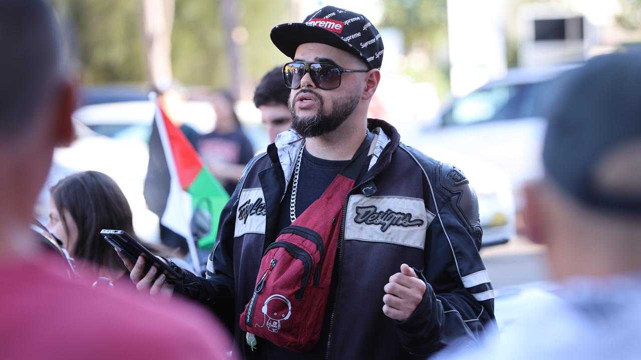 Zaky Mallahtalks to the motorcycle riders before setting off on the convoy. Picture: Damian Shaw