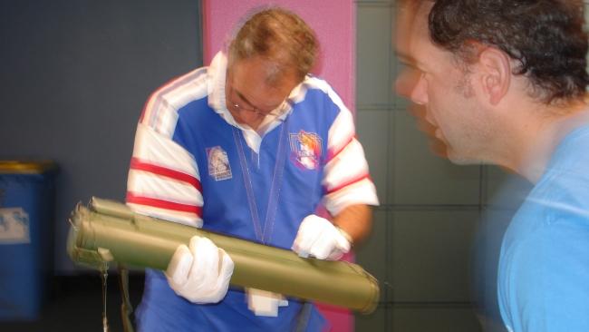 Detectives Ken McKay and Mark Wakeham with the rocket launcher seized from Adnan Darwiche.