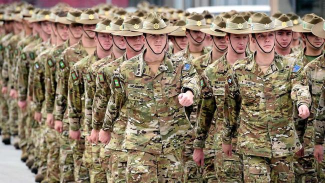 Australian Defence Forces personnel from Force Protection Element 4 (FPE4) and Force Communication Element 3 (FCE3) parade as they are farewelled before deploying to Afghanistan at Gallipoli Barracks in Brisbane, Monday, June 29, 2015. Their deployment is aimed at supporting Australia's force protection mission in Afghanistan. (AAP Image/Dan Peled) NO ARCHIVING. Picture: DAN PELED