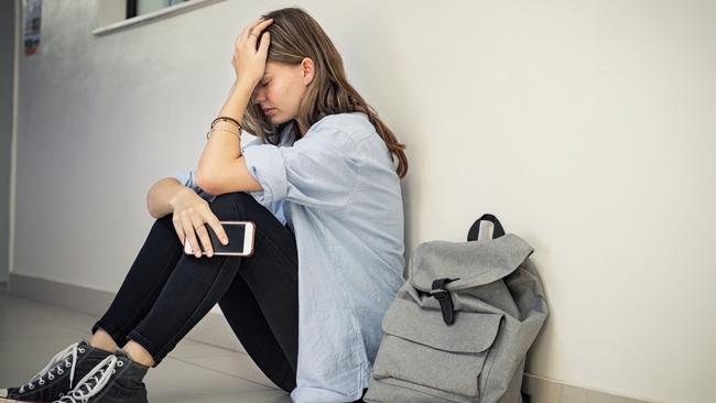 File stock image of girl bullied at school.