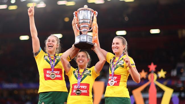 Kezie Apps celebrating Women’s World Cup glory alongside Samantha Bremner and Ali Brigginshaw. (Photo by Naomi Baker/Getty Images)