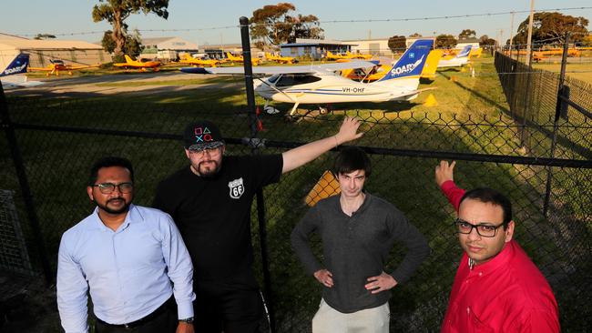 Lukesh Kumar (right) with fellow student pilots Felix, Axel &amp; Mizanur outside Soar Aviations base at Moorabbin Airport. Picture: Stuart McEvoy.