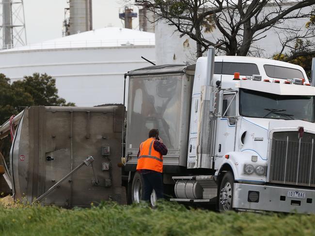 A trucks trailer rolled onto it's side spilling it's load of Soy meal onto Shell Parade, Corio. Picture: Peter Ristevski