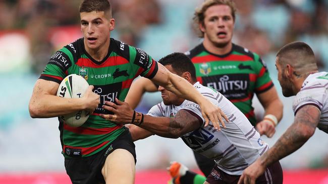 Adam Doueihi breaks a tackle for the Rabbitohs.