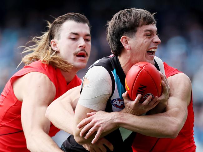 ADELAIDE, AUSTRALIA - MAY 07: Sam Draper of the Bombers tackles Zak Butters of the Power during the 2023 AFL Round 08 match between the Port Adelaide Power and the Essendon Bombers at Adelaide Oval on May 7, 2023 in Adelaide, Australia. (Photo by James Elsby/AFL Photos via Getty Images)