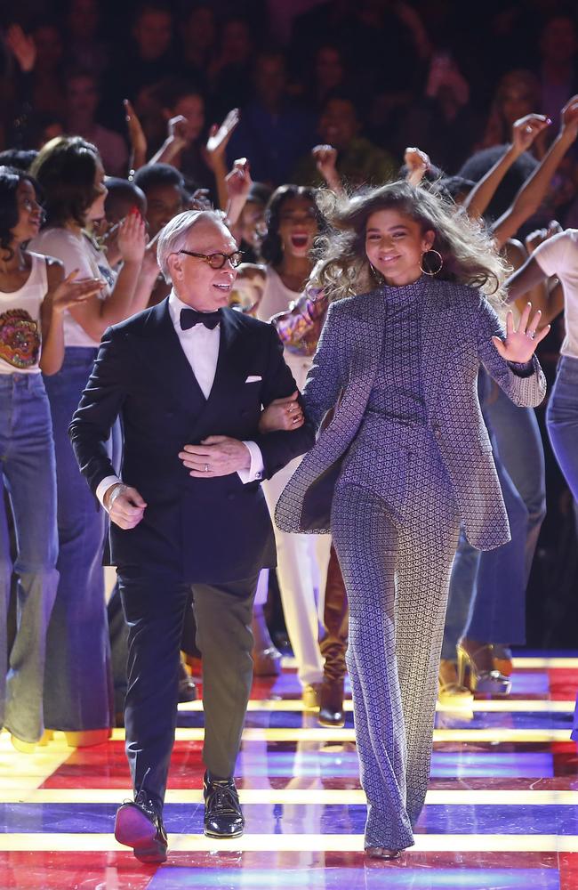 Taking a bow! Tommy Hilfiger, left, and Zendaya walked out to We Are Family to end their Paris show. Picture: AP Photo/Michel Euler