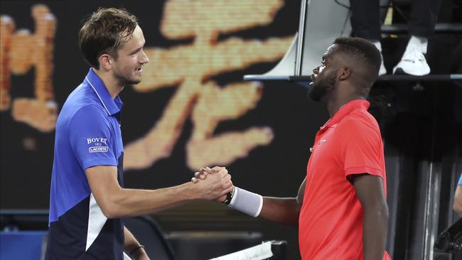 Daniil Medvedev, left, is congratulated by Frances Tiafo after the match. Picture: AP/Lee Jin-man