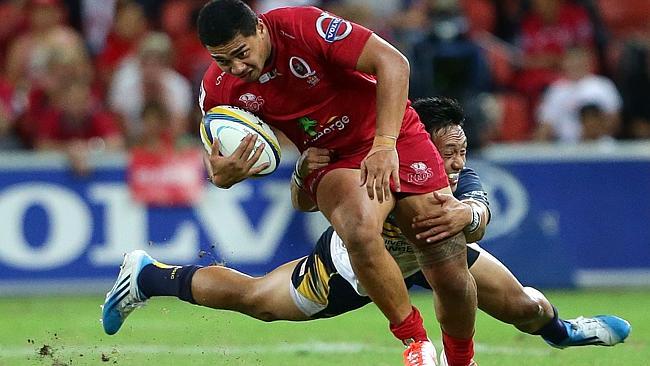 Reds winger Chris Feauai-Sautia faces a tough task stopping Julian Savea.