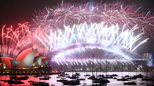 New Year's Eve fireworks erupt over the Sydney Harbour Bridge and Opera House. Picture: Peter Parks/AFP