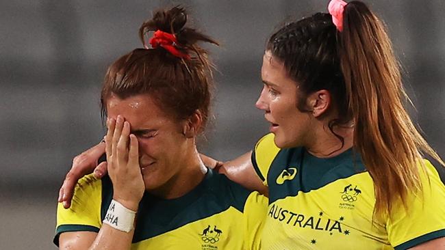 CHOFU, JAPAN - JULY 30:  Madison Ashby (L) and Charlotte Caslick (R) of Team Australia look dejected at full time in the WomenÃ¢â¬â¢s Quarter Final match between Team Fiji and Team Australia during the Rugby Sevens on day seven of the Tokyo 2020 Olympic Games at Tokyo Stadium on July 30, 2021 in Chofu, Tokyo, Japan. (Photo by Dan Mullan/Getty Images)