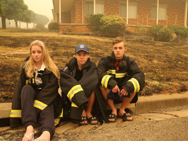 The Gould children L-R: Rayleigh, 14, Riley, 13, and Jack, 16, out the front of their house on <br/>Sunday. Picture: Rohan Kelly