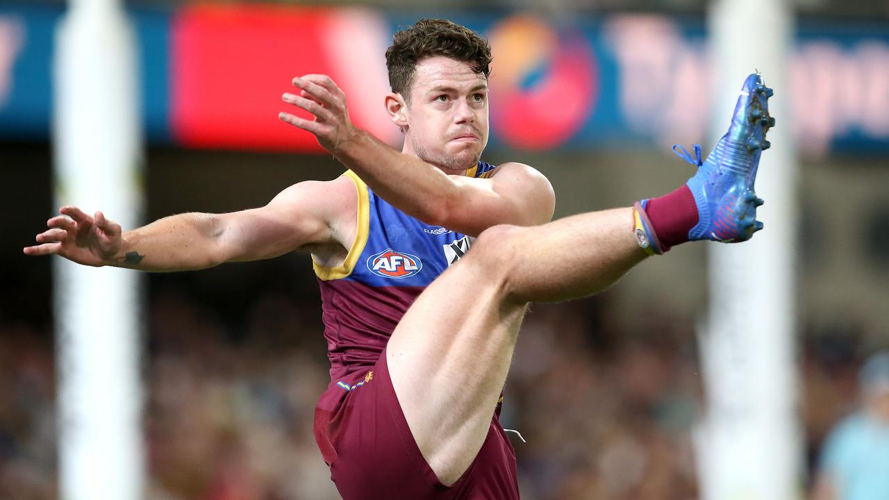 BRISBANE, AUSTRALIA - AUGUST 21: Lachie Neale of the Lions kicks the ball during the round 23 AFL match between Brisbane Lions and West Coast Eagles at The Gabba on August 21, 2021 in Brisbane, Australia. (Photo by Jono Searle/AFL Photos/via Getty Images)