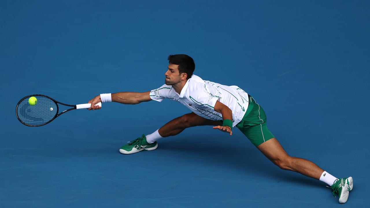 Djokovic - half volley, Novak Djokovic stretching to hit a …