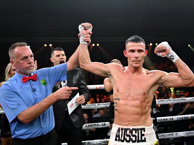 Fear raises Garside’s hand in victory. Pictures: No Limit Boxing/Gregg Porteous