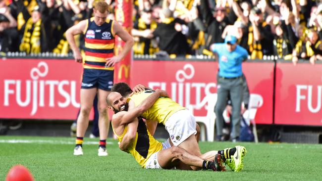 Bachar Houli hugs Trent Cotchin after the final siren. Picture: Stephen Harman