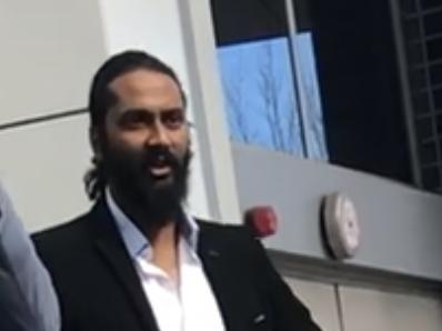 Canberra man Faizan Ahmed (left) with defence representative Derek Drewett outside Bankstown Local Court.