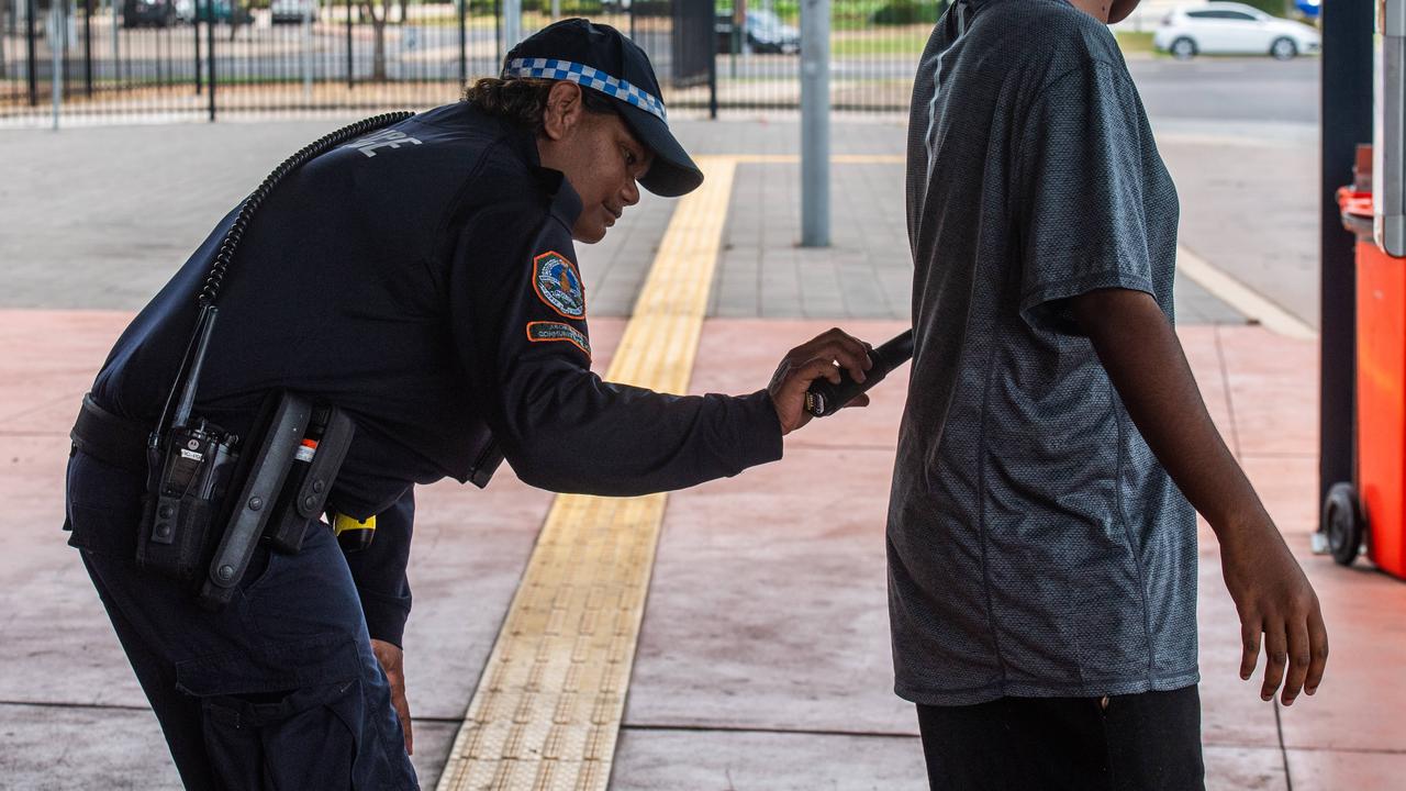 NT Police using wanding metal detectors. Picture: Pema Tamang Pakhrin