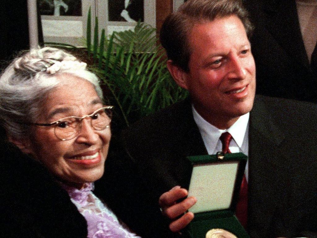 The late Ms Parks — who was arrested in 1955 for refusing to give up her seat on a bus to a white man in Montgomery, Alabama — showing her Congressional Medal of Honour to Al Gore in 1999.