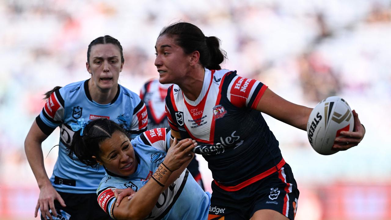 Sydney Roosters' Olivia Kernick (R) is tackled during the National Rugby League (NRL) Women's Grand Final. (Photo by Izhar KHAN / AFP)