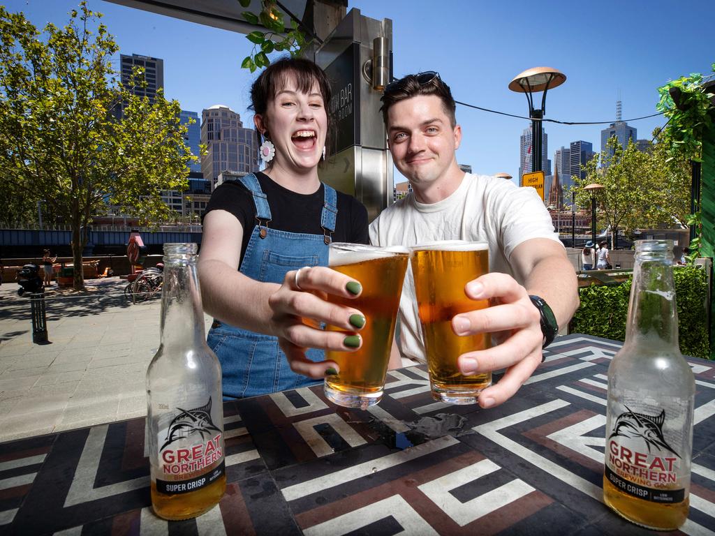 Johanna Scully, 23, and Sam Brick, 28, enjoy a Super Crisp at Ludlow Bar and Dining Room in Southbank. Picture: Mark Stewart