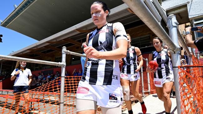 Stacey Livingstone leads her team onto the field down a quarantined section at Mineral Resources Park. Picture: AFL Photos via Getty Images