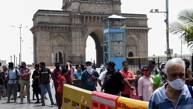 People wait in line for a compulsory Covid-19 coronavirus test before visiting the Getaway of India, in Mumbai on April 3. Picture: AFP