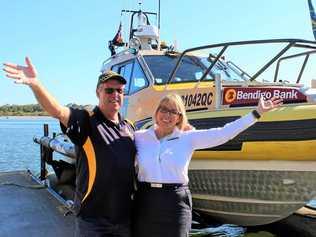 BIG WIN: Coast Guard Noosa commander Ian Hutchings and Bendigo Bank's Linda Oliver celebrating the latest funding announcement at Munna Point squadron. Picture: Contributed