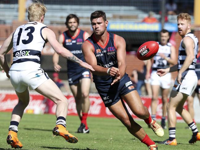 08/04/18 - SANFL - Norwood v South Adelaide at Coopers Stadium. Mitch Grigg gets his handpass away. Picture SARAH REED