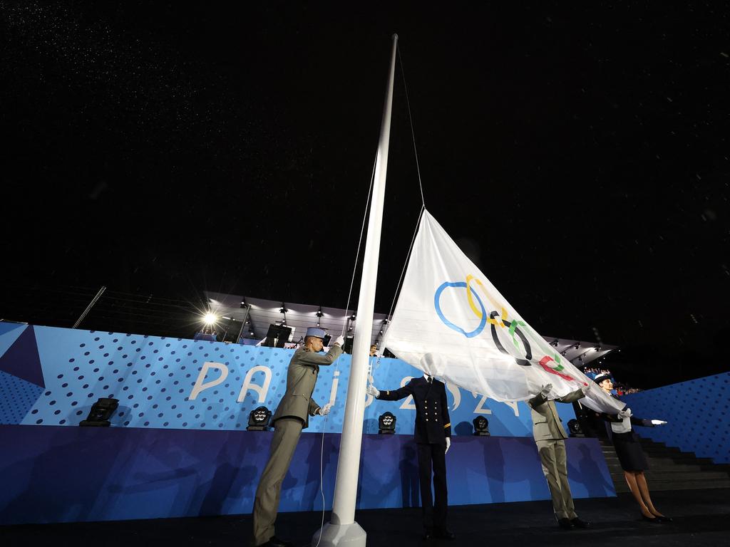 The Olympic Flag is raised upside down during the opening ceremony. Picture: Cameron Spencer / POOL / AFP