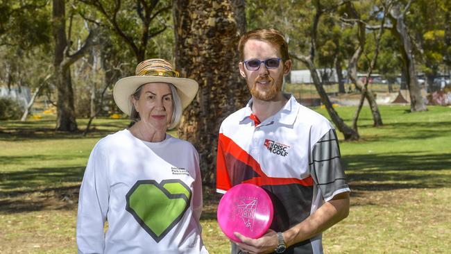 Elizabeth Rushbrook and William Brennan with the trees damaged by the disc golfers. Picture: RoyVPhotography