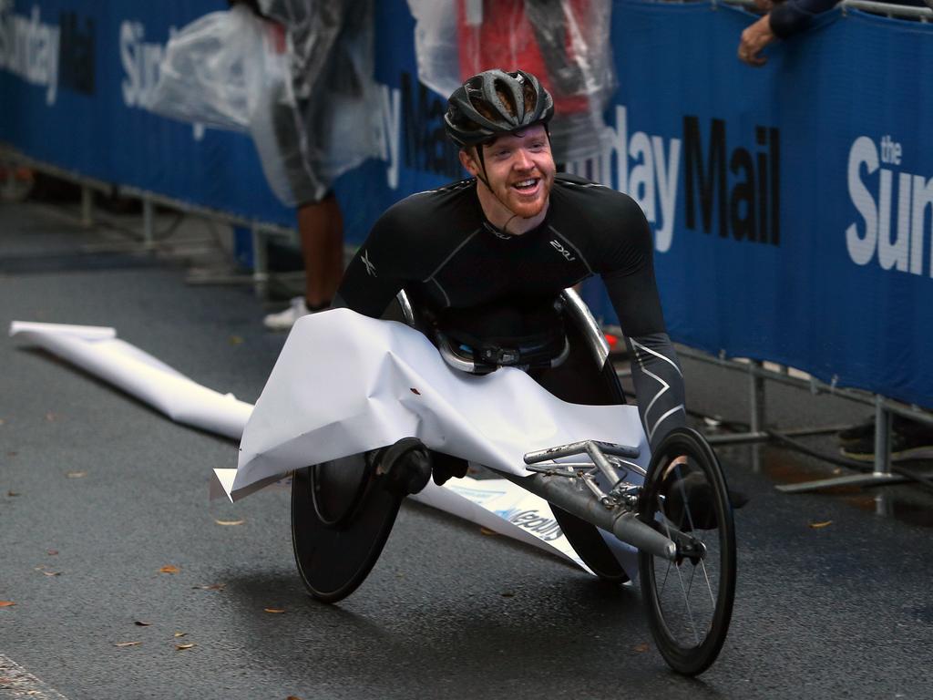 <p>Dan Carter, winner in the wheelchair 10 klm in the Bridge to Brisbane race. Sunday, August 26, 2018 (AAP Image/Richard Waugh)</p>