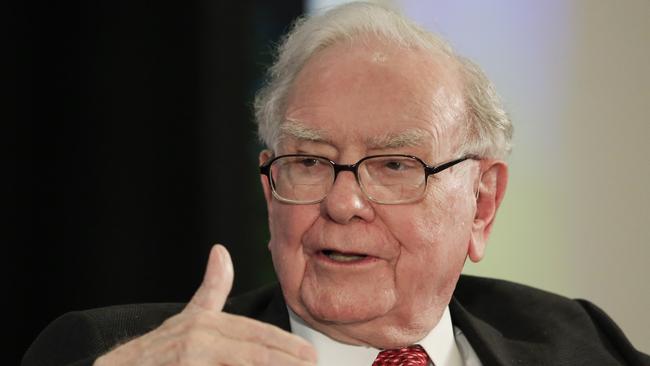 FILE - In this Oct. 3, 2017, file photo, investor Warren Buffett gestures on stage during a conversation with CNBC's Becky Quick, at a national conference sponsored by the Purpose Built Communities group that Buffett supports, in Omaha, Neb. Buffettâ€™s Berkshire Hathaway is adding Gregory E. Abel and Ajit Jain as directors, boosting the size of its board to 14 members. The company said Wednesday, Jan. 10, 2018, that Buffett and Charles T. Munger, Berkshire Hathaway's vice chairman, will retain their positions on the board. (AP Photo/Nati Harnik, File)