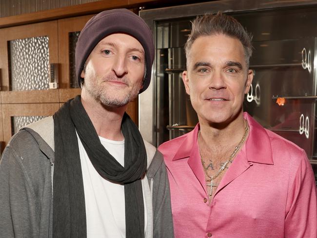 Better Man director Michael Gracey with Robbie Williams. Picture: Getty Images