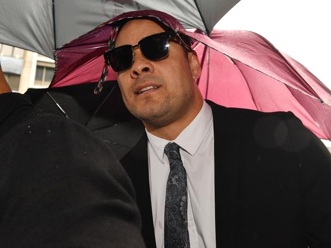 NEWCASTLE, AUSTRALIA - MAY 06: Jarryd Hayne arrives, surrounded by supporters, at Newcastle District Court on May 06, 2021 in Newcastle, Australia. Former NRL player Jarryd Hayne was found guilty on two counts of sexual assault on March 22 2021.  The 33-year-old faces up to 14 years in jail at his sentence hearing today. (Photo by Sam Mooy/Getty Images)