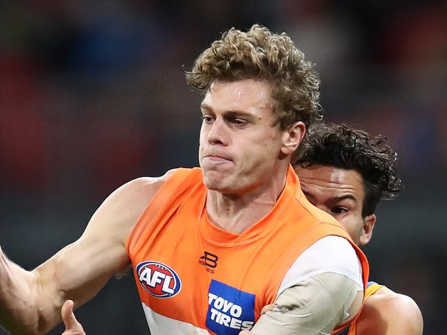 Adam Kennedy of the Giants contests the ball with Cam Rayner of the Lions during the Round 16 AFL match between the GWS Giants and the Brisbane Lions at Sydney Showground Stadium in Sydney, Sunday, July 7, 2019. (AAP Image/Brendon Thorne) NO ARCHIVING, EDITORIAL USE ONLY