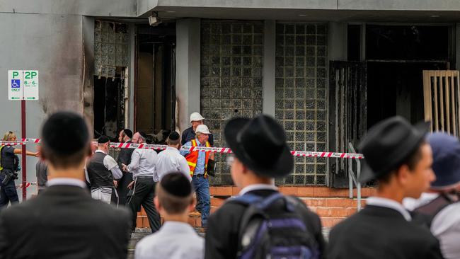 Members of the local Jewish community look at the damage of the arson attack at the Adass Israel Synagogue. Picture: Asanka Ratnayake/Getty Images