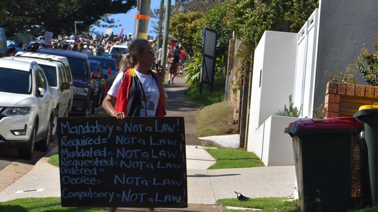 A woman argues with onlookers. Photo: Liana Walker