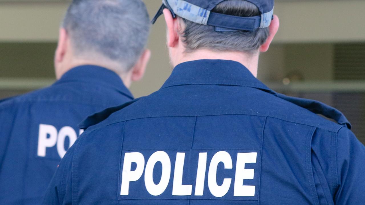 A Top End family claims police questioned a crying 14-year-old student over a crime she did not commit and stopped her principal from calling her parents, in a potential violation of the Youth Justice Act. Picture: Glenn Campbell