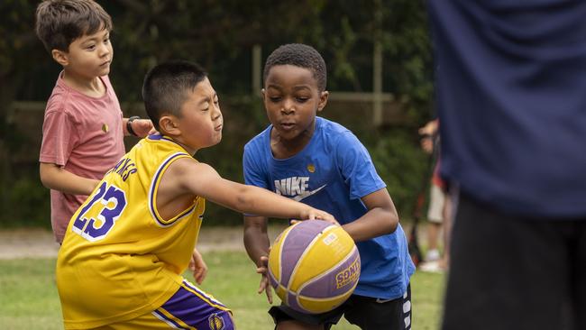 Local kids at a basketball workshop with Brittany Smart Sydney Uni Flames WNBL at the new basketball courts in Morrison Bay Park in Putney. Picture: Matthew Vasilescu