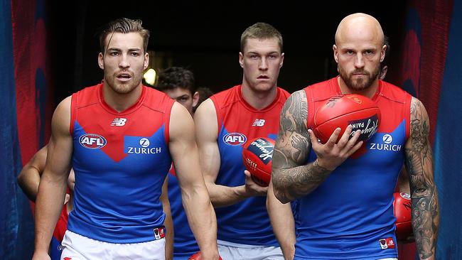 Jack Viney and Nathan Jones lead the Demons onto the MCG. Picture: Michael Klein