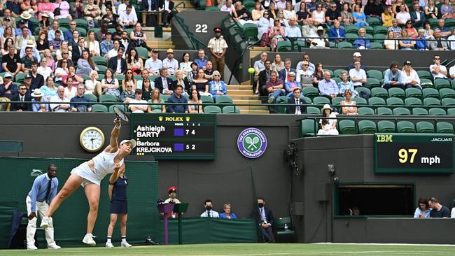 Ashleigh Barty serves to the Czech Republic's Barbora Krejcikova on the seventh day of Wimbledon.