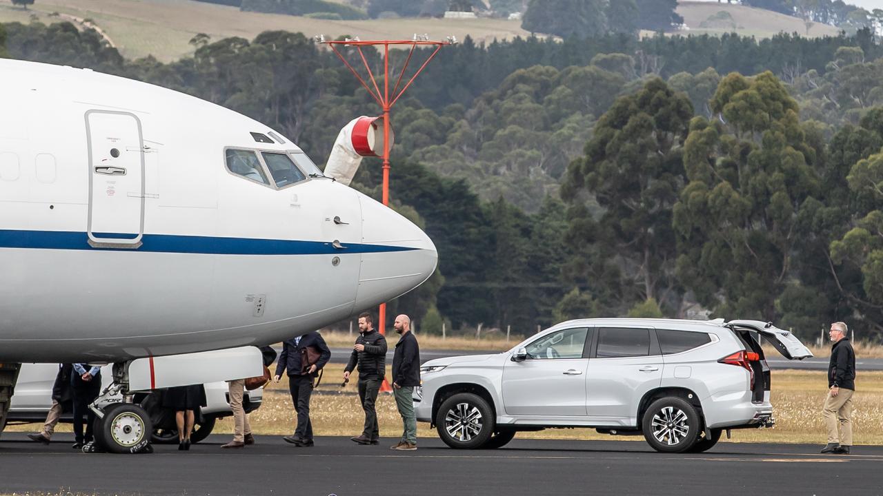 Prime Minister Scott Morrison and his security detail board a plane on the tarmac. Picture: Jason Edwards