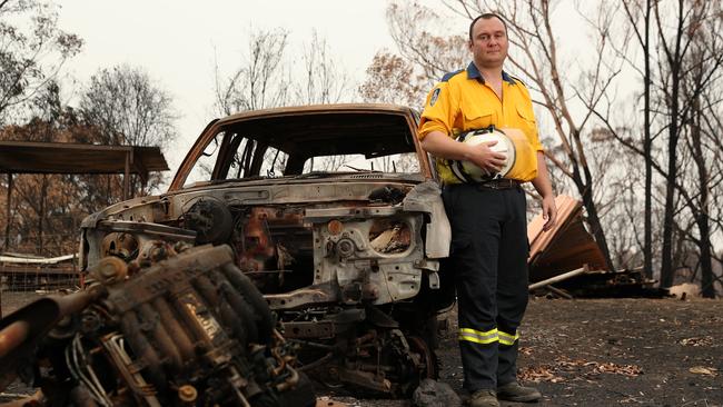 RFS firefighter John Gallagher at the home of Mr Pauling's parents in Quaama. Picture: Jonathan Ng