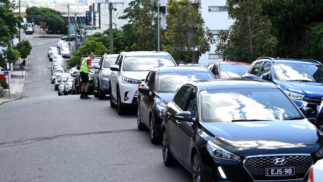 Cars are seen lined up as people wait to be COVID tested after Queensland Premier Annastacia Palazczuk announced a three-day lockdown for the Greater Brisbane area (Photo by Bradley Kanaris/Getty Images).