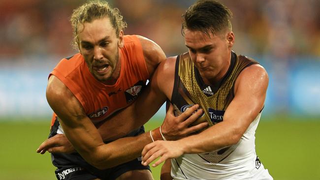 Matt Buntine wrestles with Kieran Lovell.