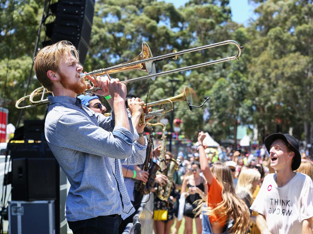 Having a blast. The brass section from the Hot Potato Band wows the crowd. Picture: Jess Husband.