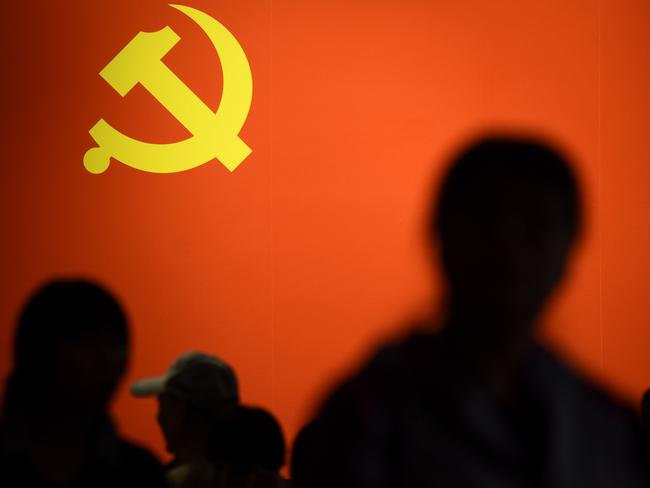 TOPSHOT - This picture taken on October 10, 2017 shows a party flag of the Chinese Communist Party displayed at an exhibition showcasing China's progress in the past five years at the Beijing Exhibition Center. China's police and censorship organs have kicked into high gear to ensure that the party's week-long, twice-a-decade congress goes smoothly when it begins on October 18. / AFP PHOTO / WANG ZHAO / TO GO WITH CHINA-POLITICS-SECURITY, FOCUS BY BECKY DAVIS